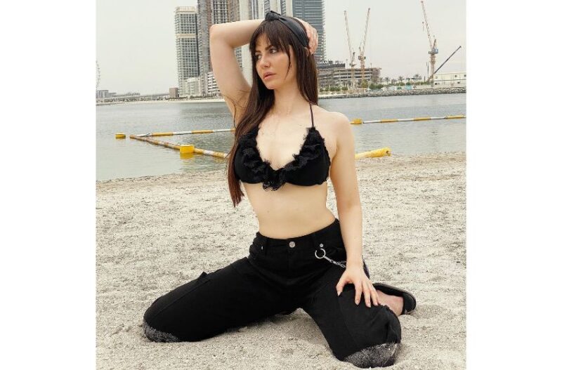 Giorgia Andirani looks sultry in a black bikini bralette paired with black joggers.