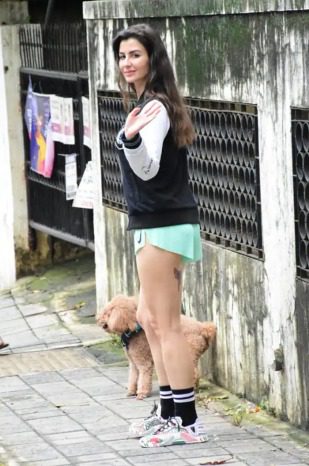 Giorgia Andriani looks stunning in super hot shorts as she takes her dog for a walk